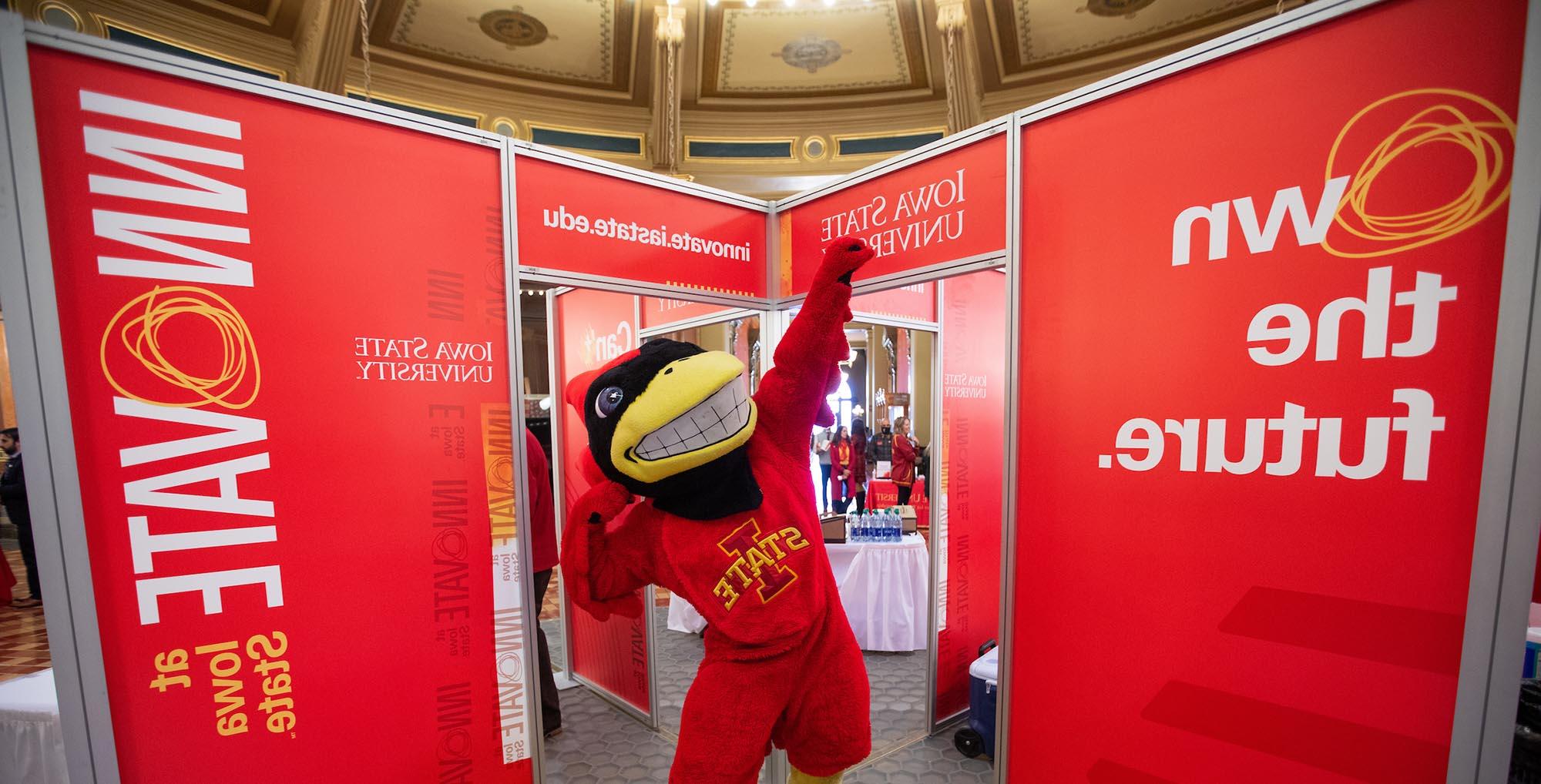 Cy mascot strikes a pose in the Iowa Capitol during ISU day